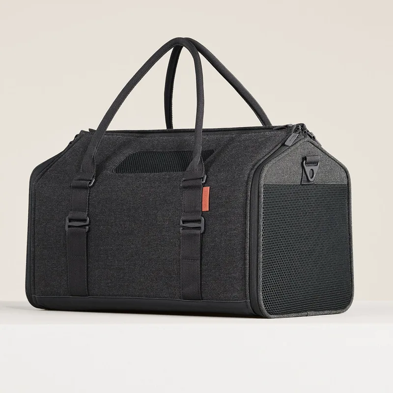 The Porto cat carrier in charcoal, a soft-sided bag with mesh panels and two handles